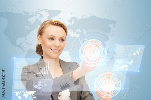 Photo: businesswoman working with virtual screens businesswoman working with virtual screens