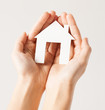 woman hands with paper house