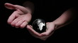 Animation of hands revealing globe earth