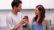Couple toasting in the kitchen