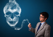 Young man smoking dangerous cigarette with toxic skull smoke