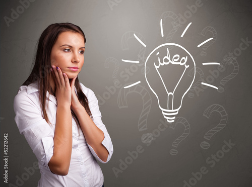 Photo: Young girl comming up with a light bubl idea sign Young girl comming up with a light bubl idea sign