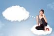 Photo: Young girl sitting on cloud and thinking of abstract speech bubb Young girl sitting on cloud and thinking of abstract speech bubb