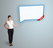 young woman presenting modern speech bubble copy space