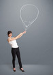 Beautiful woman holding balloon drawing
