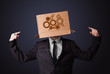 Young man gesturing with a cardboard box on his head with spur w