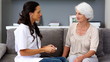 Home nurse checking her patients breathing