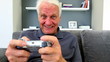 Old man playng video games