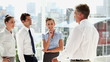 Business man speaking with colleagues
