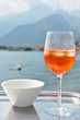 Photo: Traditional Italian Spritz cocktail against lake Como, Italy Traditional Italian Spritz cocktail against lake Como, Italy