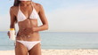 Woman with a drawing of sun made with cream on her body