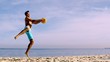 Man jumping to catch a frisbee