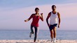 People running to the camera on the beach