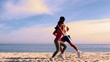 People running on the beach