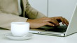 Businesswoman typing on her laptop