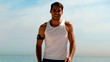 Sportsman jogging towards camera on the beach