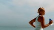 Sportswoman jogging across the beach