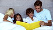 Parents reading a story to their children