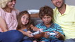 Parents watching their chidren playing video games