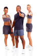 group of happy gym instructors giving thumbs up