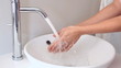 Someone washing their hands
