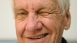Old man winking an eye