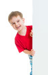 kid boy behind blank advertising banner