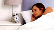Woman waking up and realising she is late