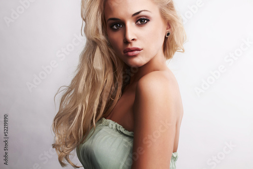 Photo: Beautiful fashion blond woman in blue dress Beautiful fashion blond woman in blue dress