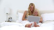 Mother and daughter using laptop together