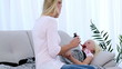 Mother giving her daughter medicine on a spoon