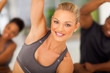 fit woman stretching with friends