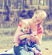 happy family. mother and baby for a walk in the park for nature