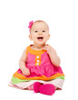 happy little baby girl in bright multicolored festive dress isol