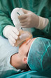 Close up of a nurse putting an oxygen mask on a patient