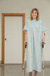 Female patient walking with crutches