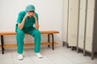 Sad nurse sitting on a bench
