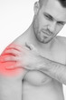 Man touching painful shoulder