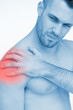 Man touching painful highlighted shoulder