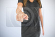 Businesswoman pressing on touchscreen panel