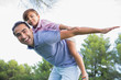 Father and son playing airplanes