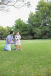Father teaching son to play football