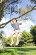 Little boy having fun on a swing
