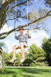 Portrait of cute boy on a swing