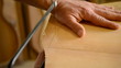 Cutting wood with a hacksaw, close up