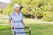 Happy elderly woman with zimmer frame