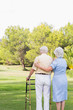 Elderly couple standing in park