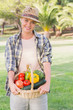 Pretty blonde carrying basket of vegetables
