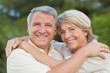 Portrait of older couple hugging