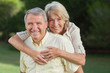 Man giving his partner a piggy back